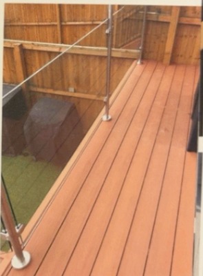 Amber composite decking design inspiration — Raised Deck & Glass Balustrade