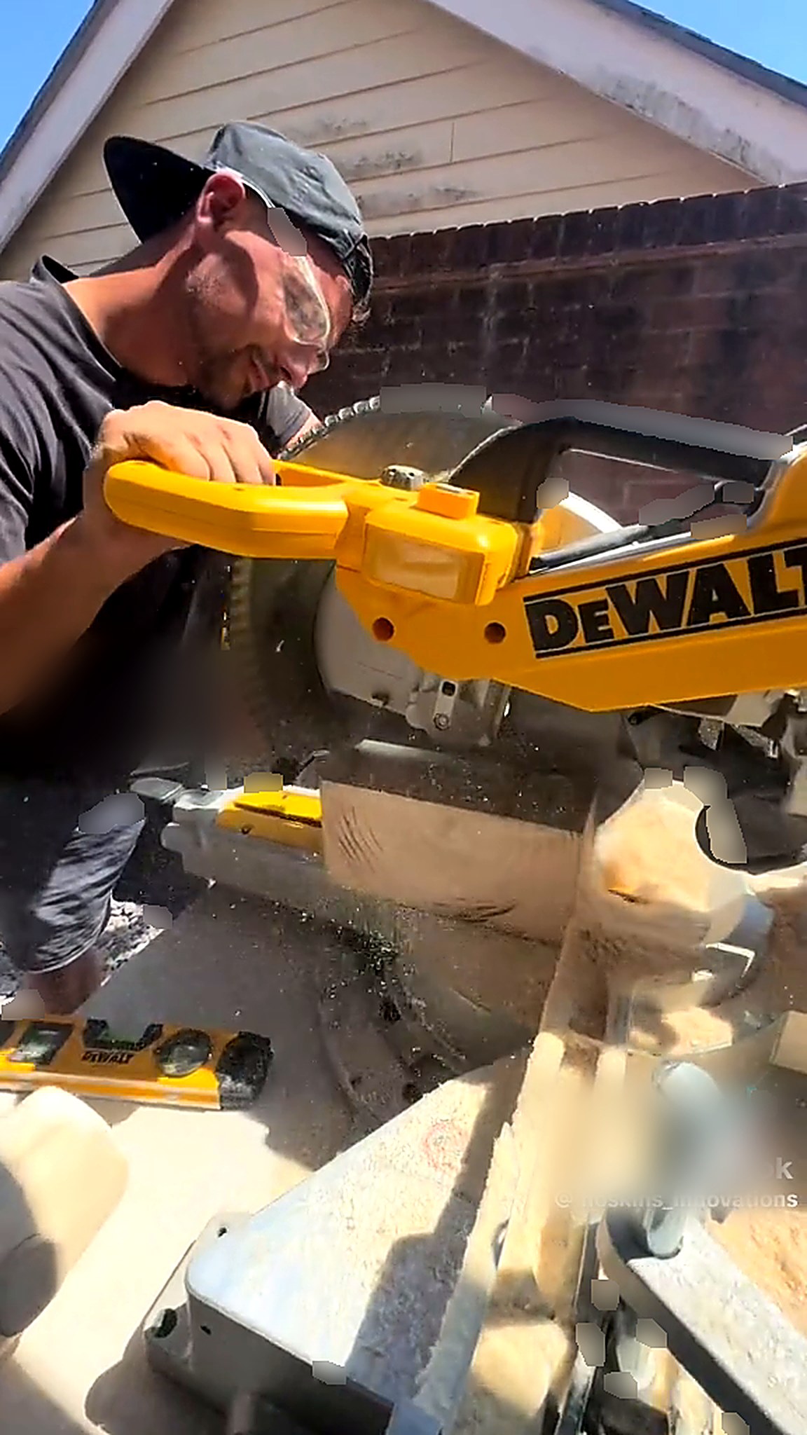 Timber sleeper being cut on a mitre saw