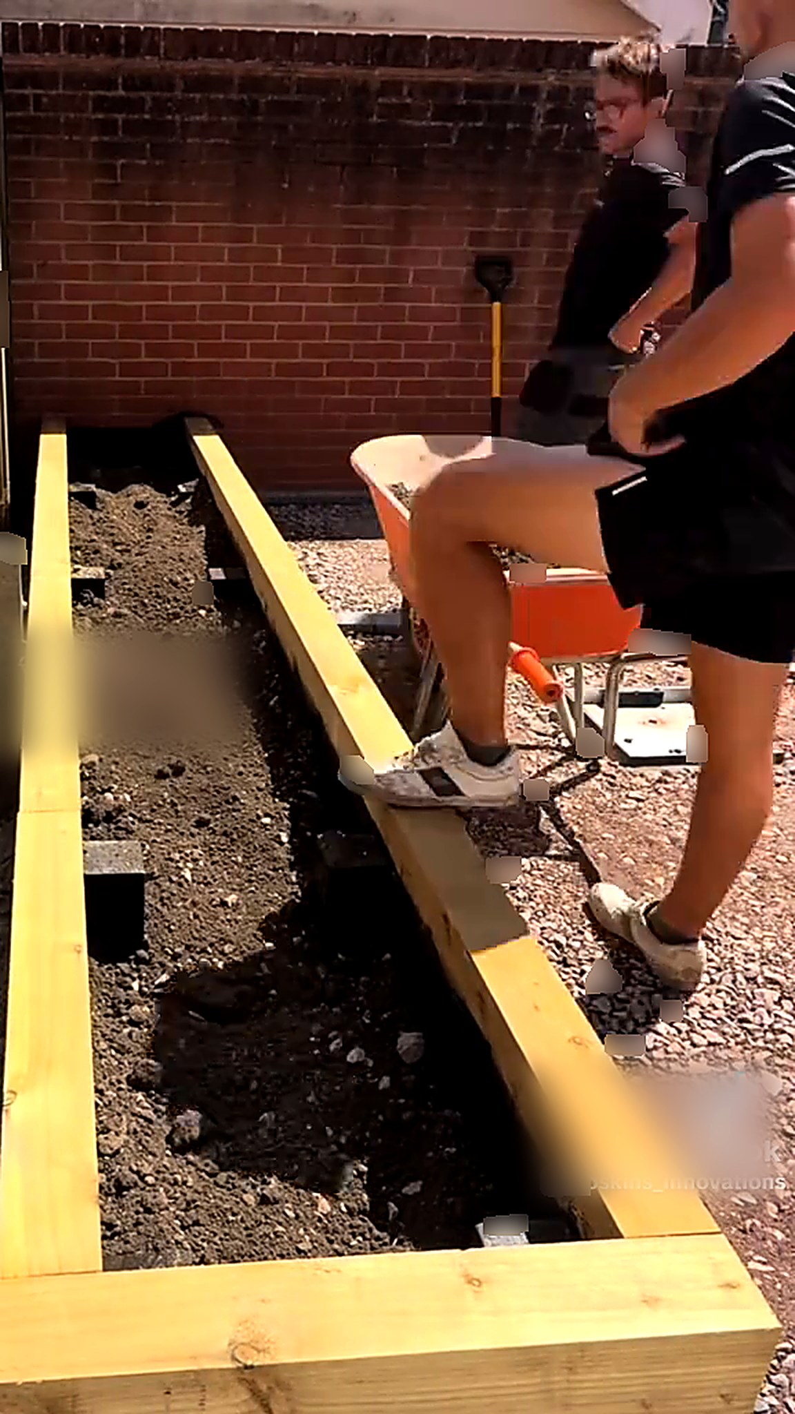 Timber raised bed frame set into the excavated ground