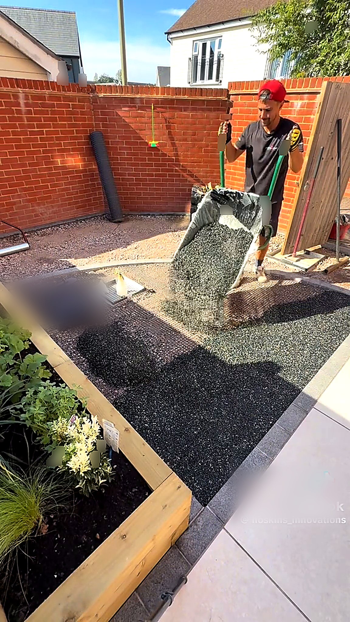 Compacted sub-base and gravel laid across a small garden