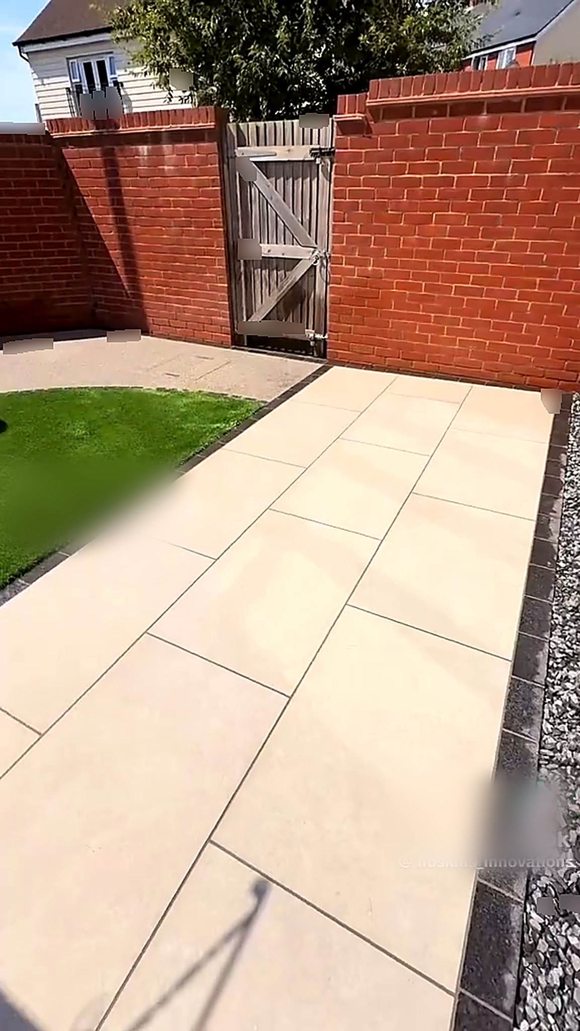 Completed courtyard with porcelain terrace and curved lawn