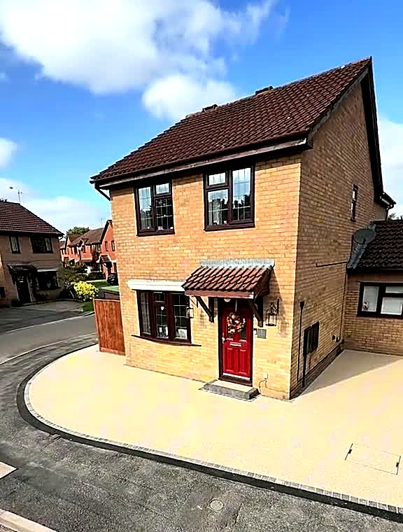 Completed resin bound driveway seen from the road outside a Kendal house