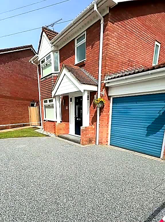 Completed two-tone resin driveway with granite sett edging in Carlisle