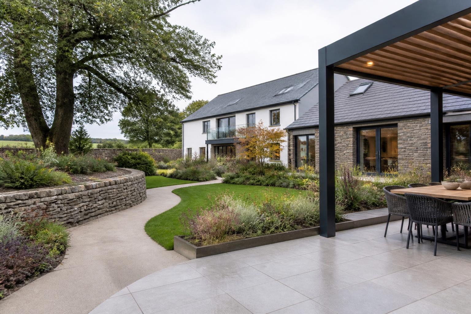 Contemporary Cumbrian garden with planting and lawn in daylight