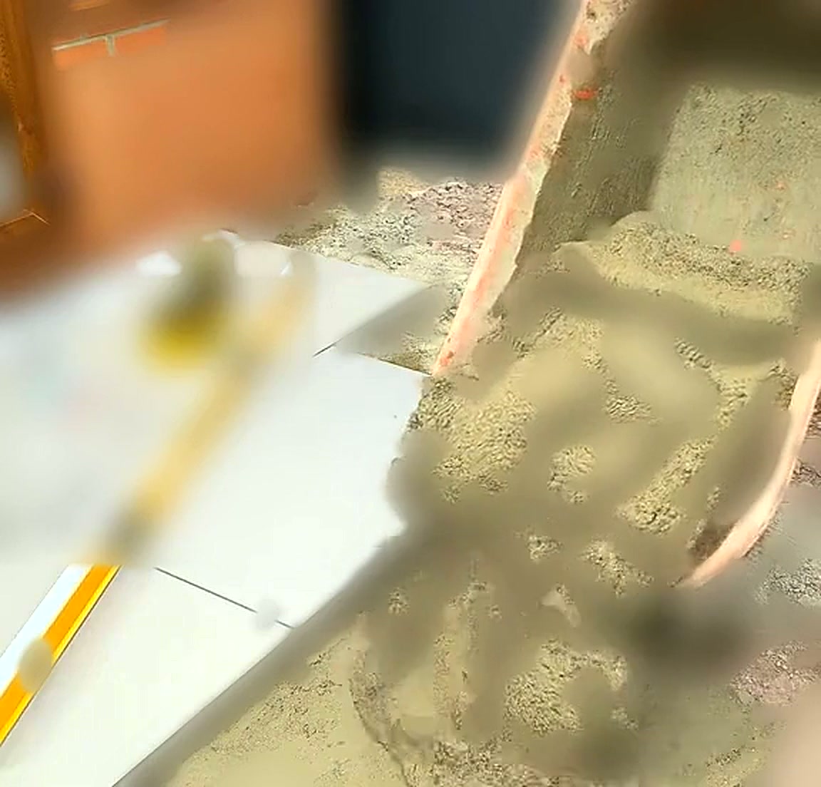 Full sand and cement mortar bed being prepared for porcelain paving