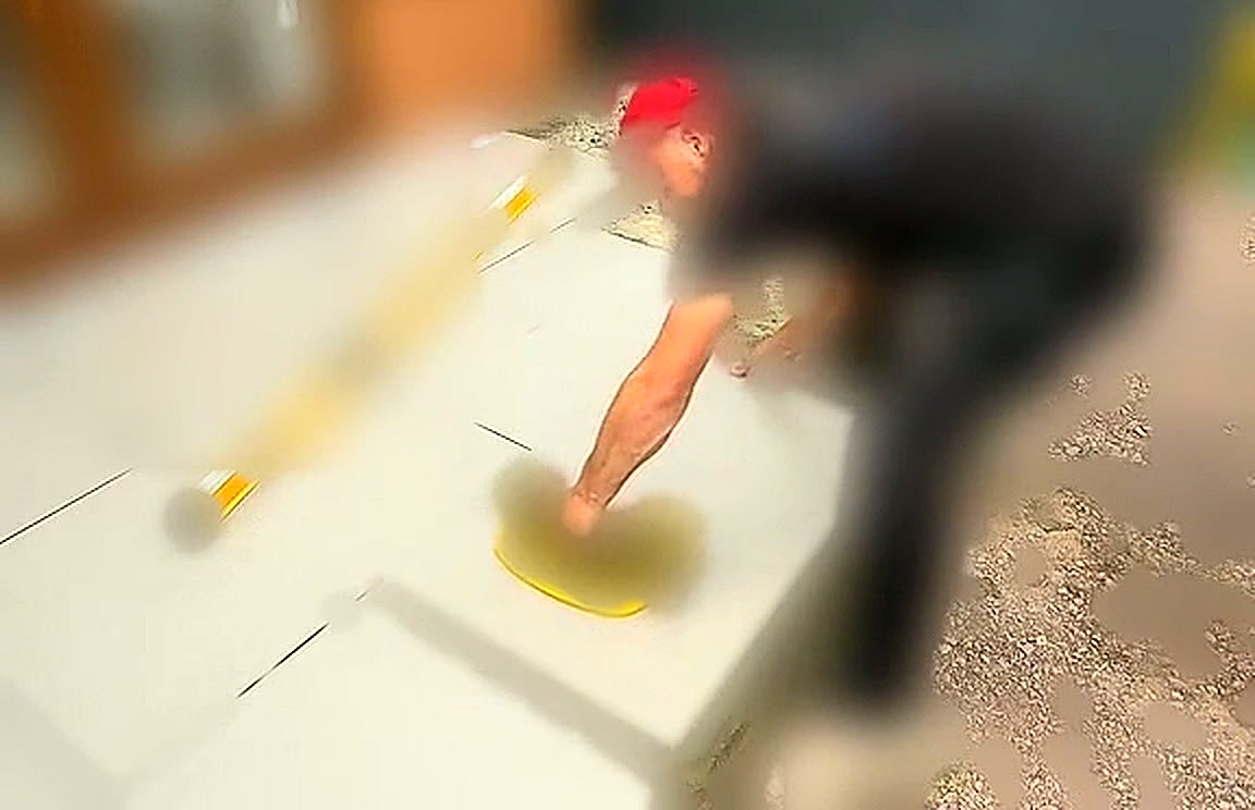 Slab being tapped down onto the mortar bed