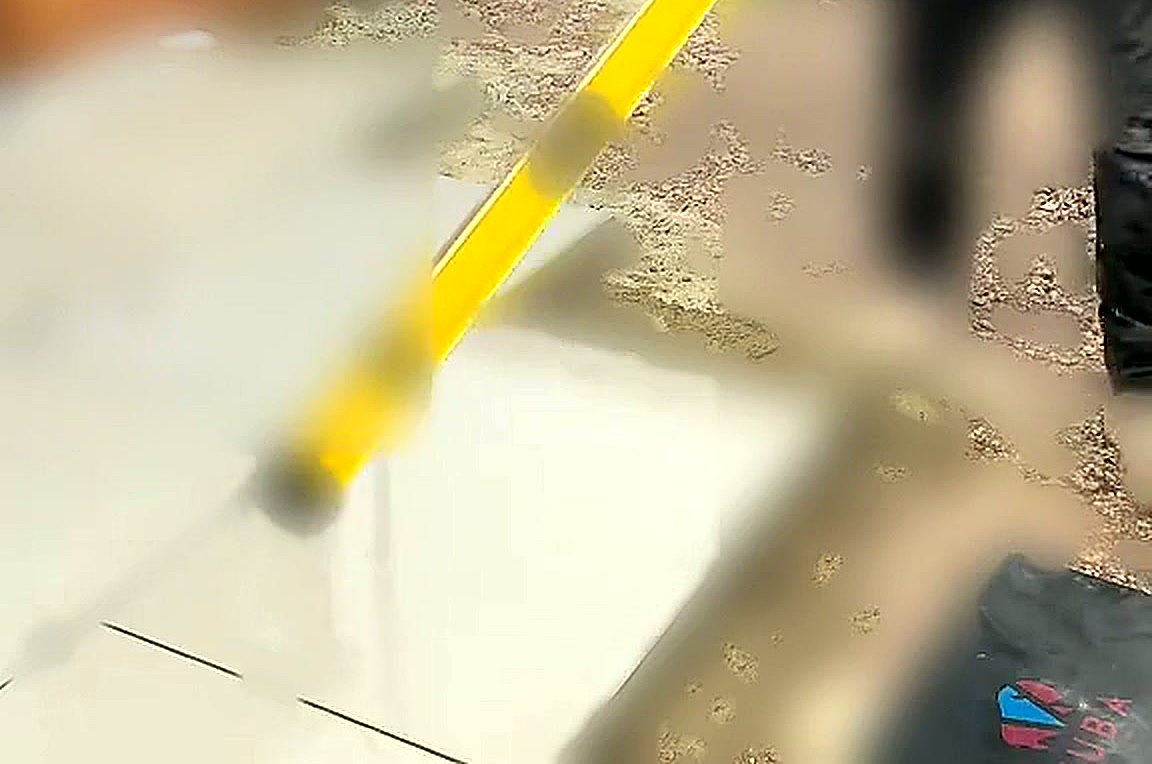 Levels being checked across a newly laid porcelain terrace