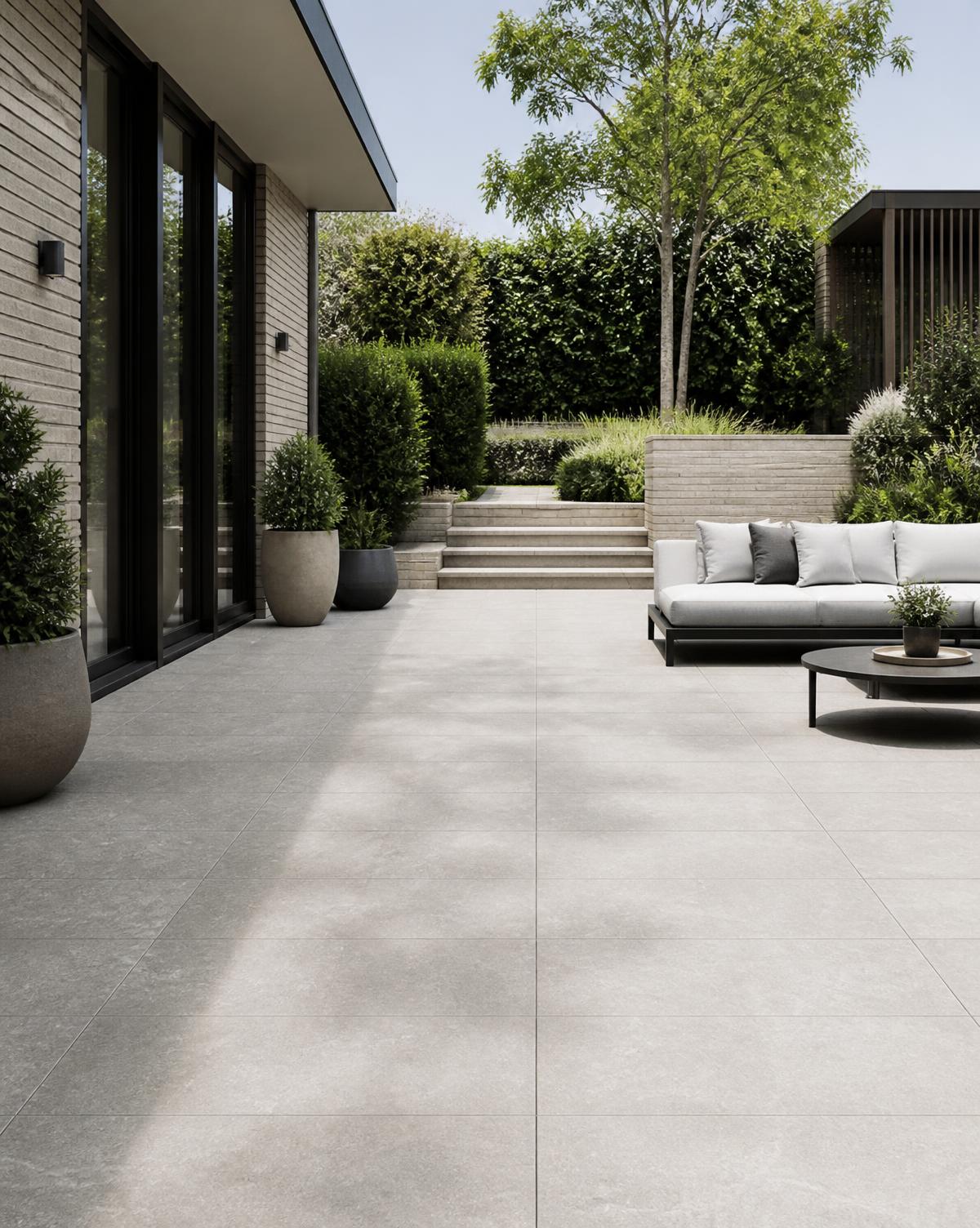 Large format porcelain paving patio with contemporary outdoor seating